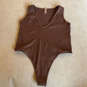 Brown body suit